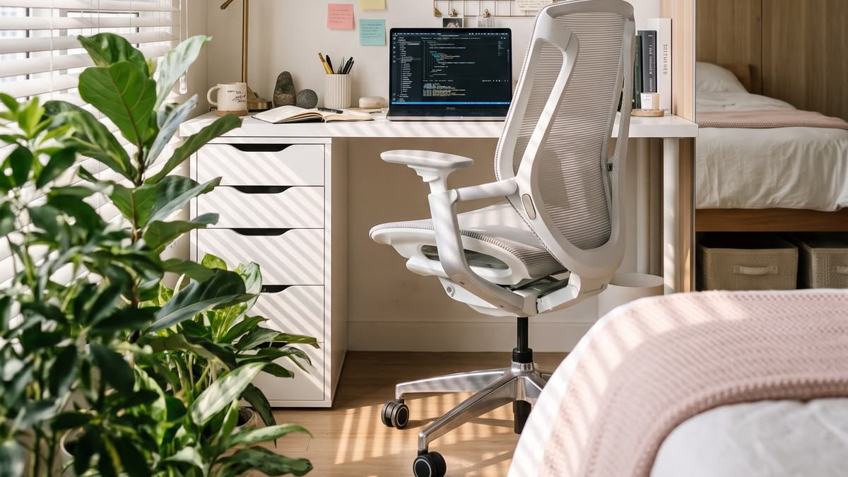 White Vatalla BIRCH ergonomic chair beside a desk in a sunlit bedroom home office