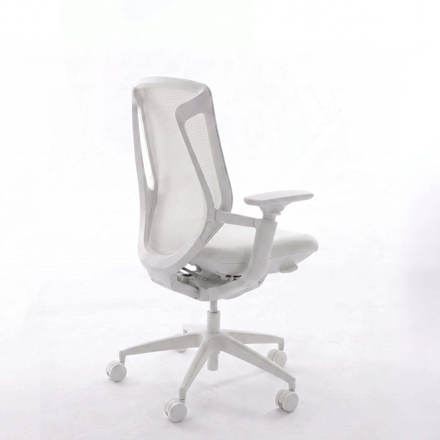 White BIRCH ergonomic chair in rear three-quarter view showing its mesh back and adjustable armrest