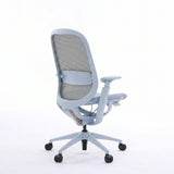 Light blue O2 ergonomic chair in rear three-quarter view showing the mesh back and lumbar support